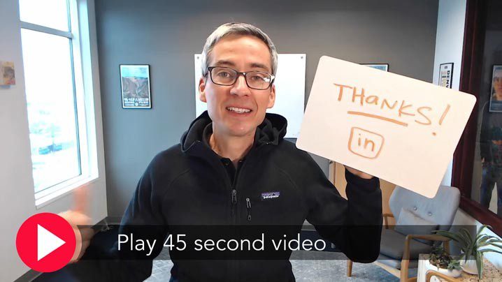 Man holding "Thanks! LinkedIn" sign.