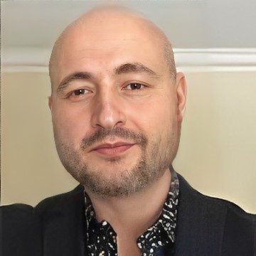 Headshot of a man with a beard.