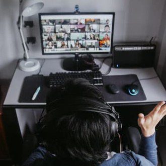 Person on a video call with many participants.